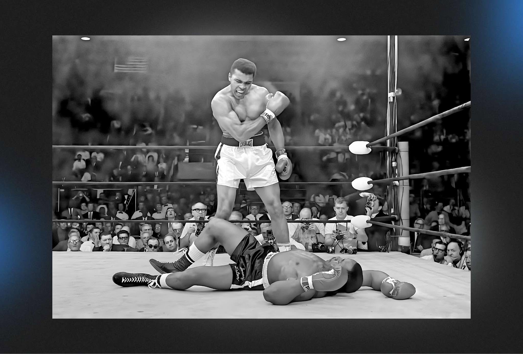 Muhammad Ali stands over a fallen Sonny Liston after their 1965 heavyweight title rematch in Lewiston, Maine.