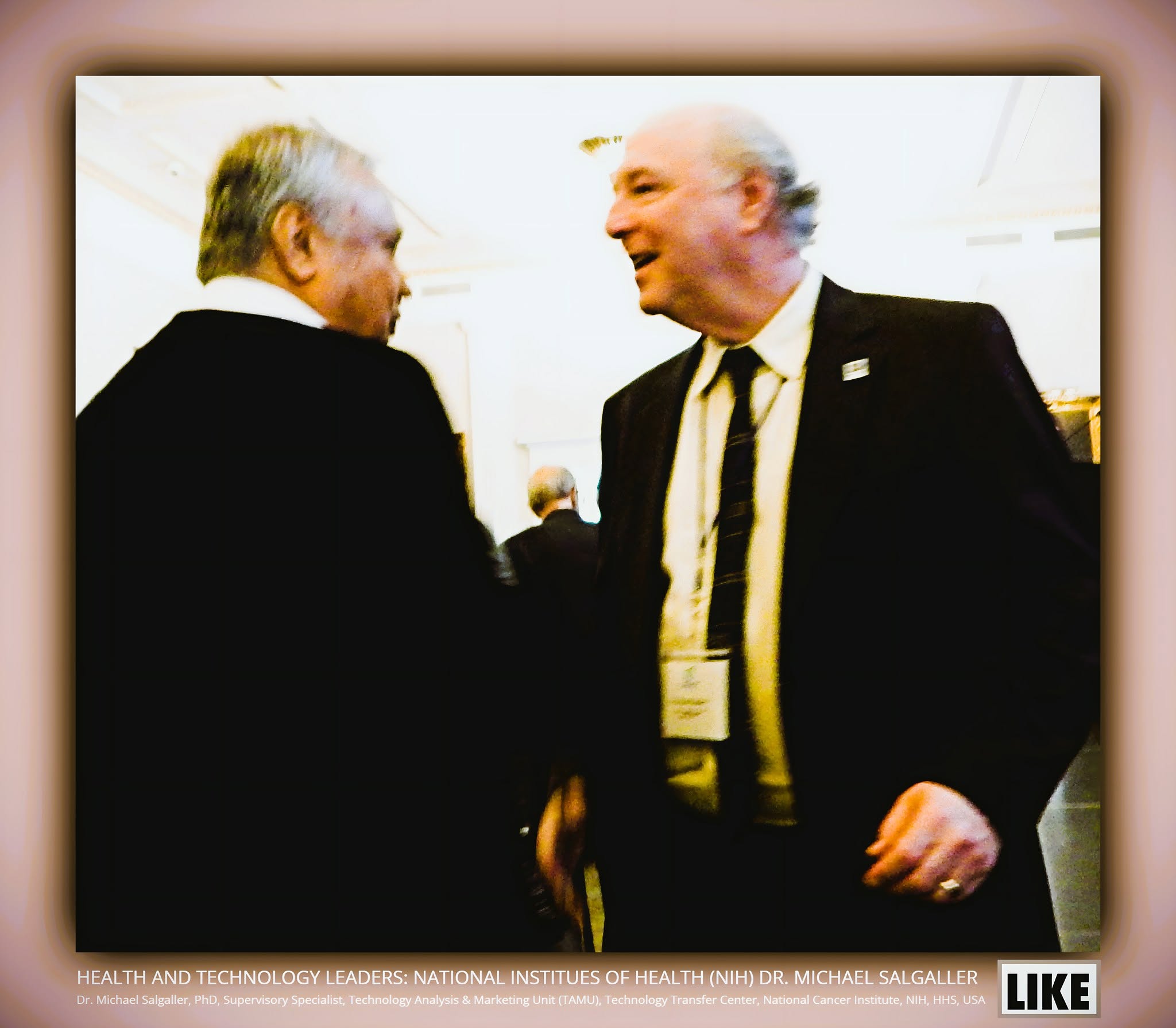 Dr. Michael Salgaller chats with a guest at a health and technology leaders event.
