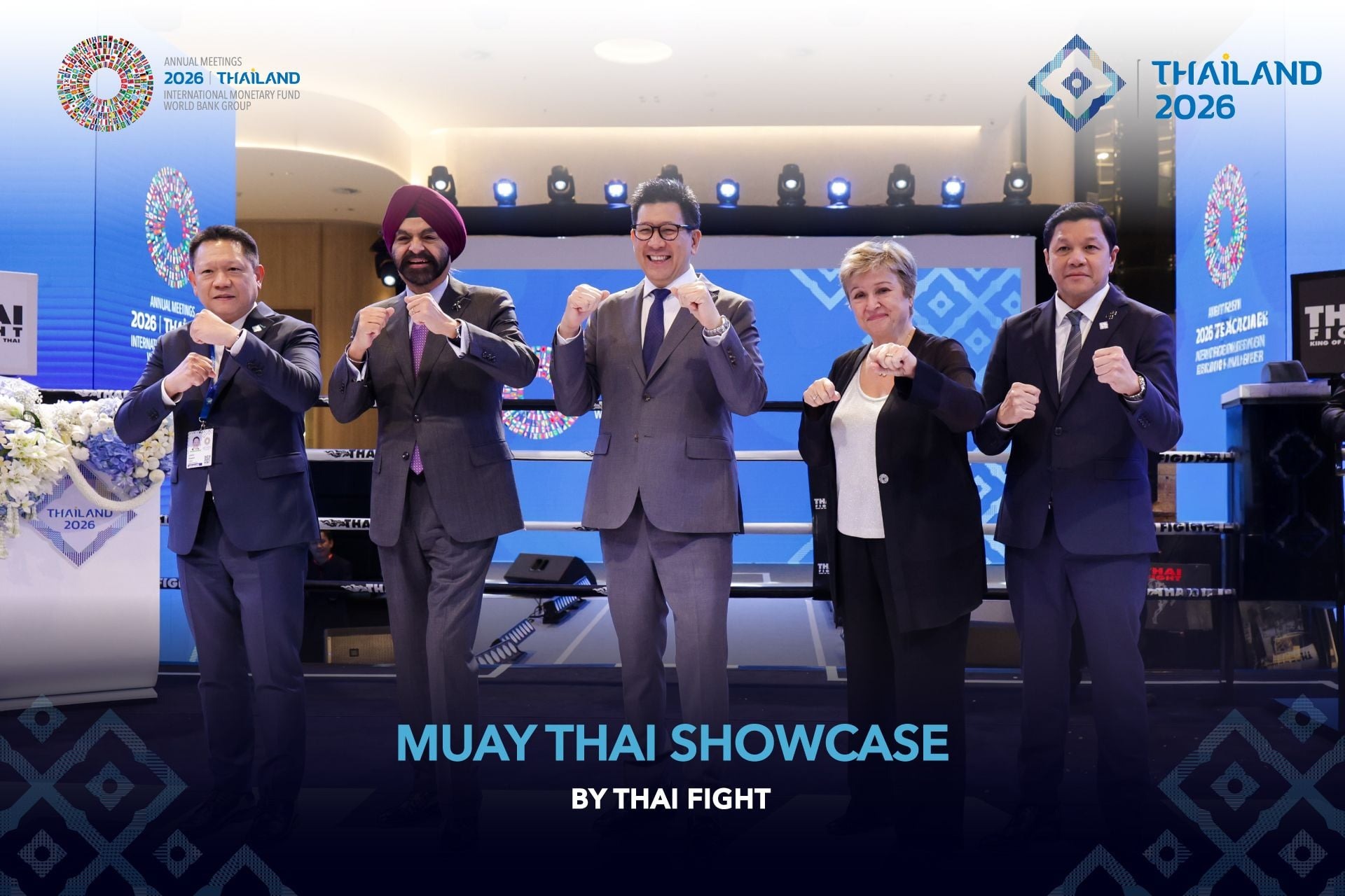 Ajay Banga and Kristalina Georgieva strike Muay Thai poses with Thai officials at the Thai Fight showcase.