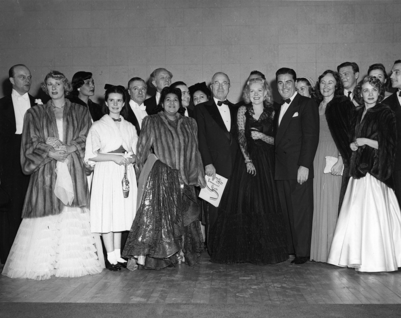 President Harry S. Truman poses with performers at the 1949 inaugural gala at the National Guard Armory, Washington, D.C., including Edgar Bergen, Lena Horne, Dorothy Maynor, Alice Faye, Jane Powell and Gene Kelly.