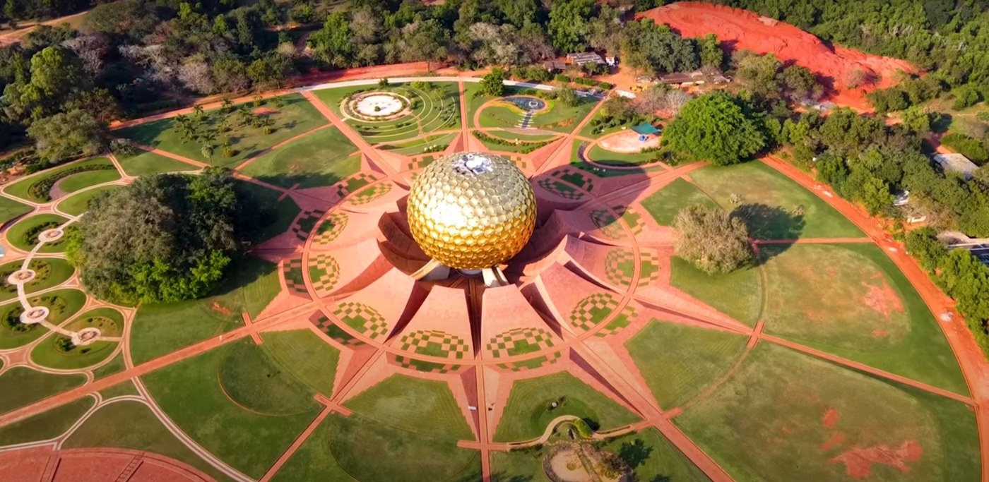 Drone aerial view of the Matrimandir and its geometric gardens