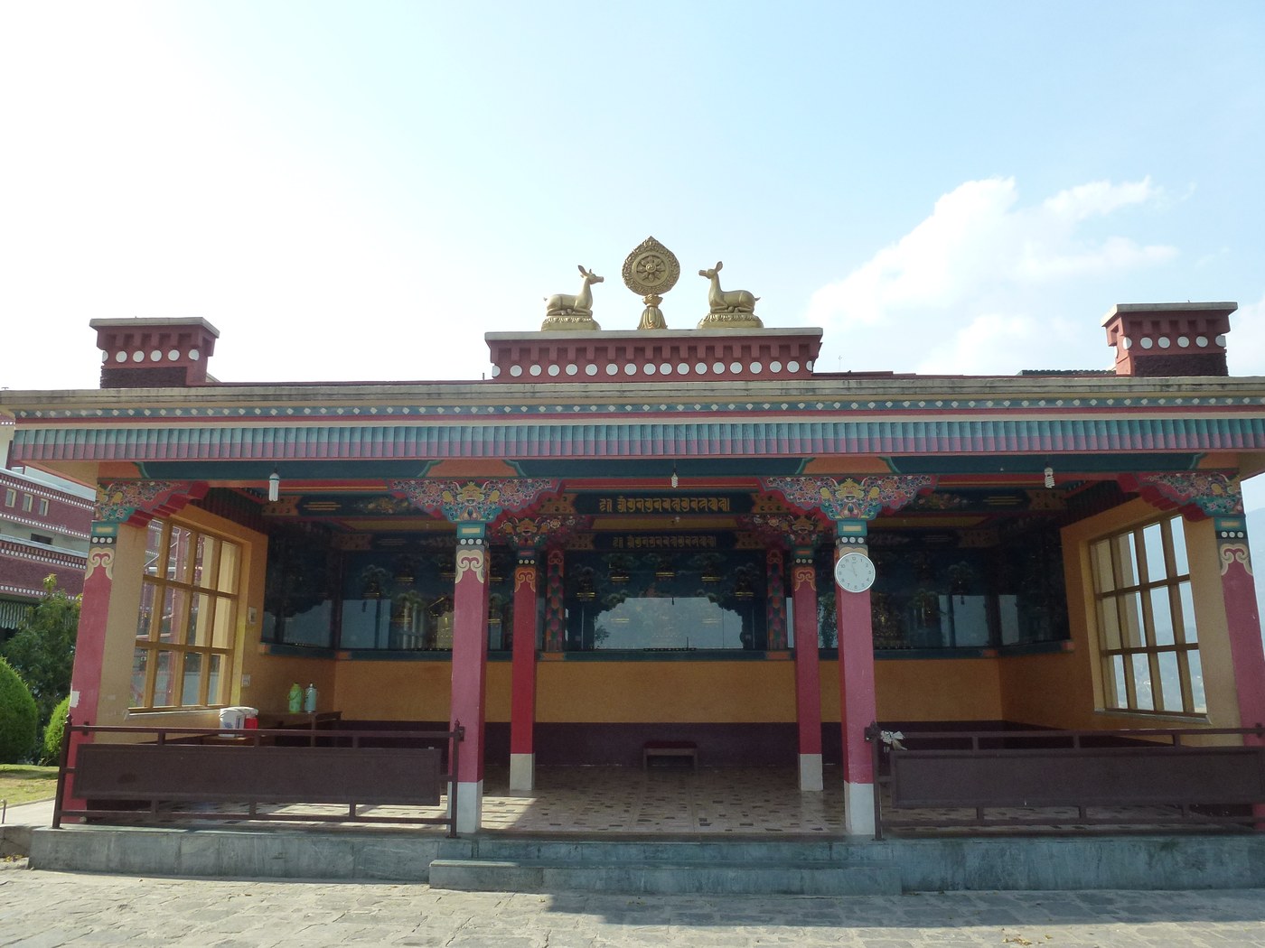 Temple building with ornate facade and deer/Dharma-wheel roof ornaments