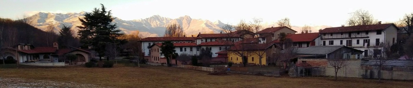Panorama of the community buildings at the foot of the Biellese Alps