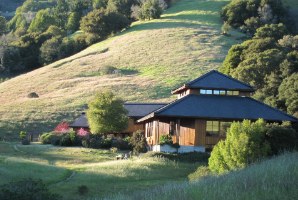 Upper Retreat Hall set into its wooded hillside
