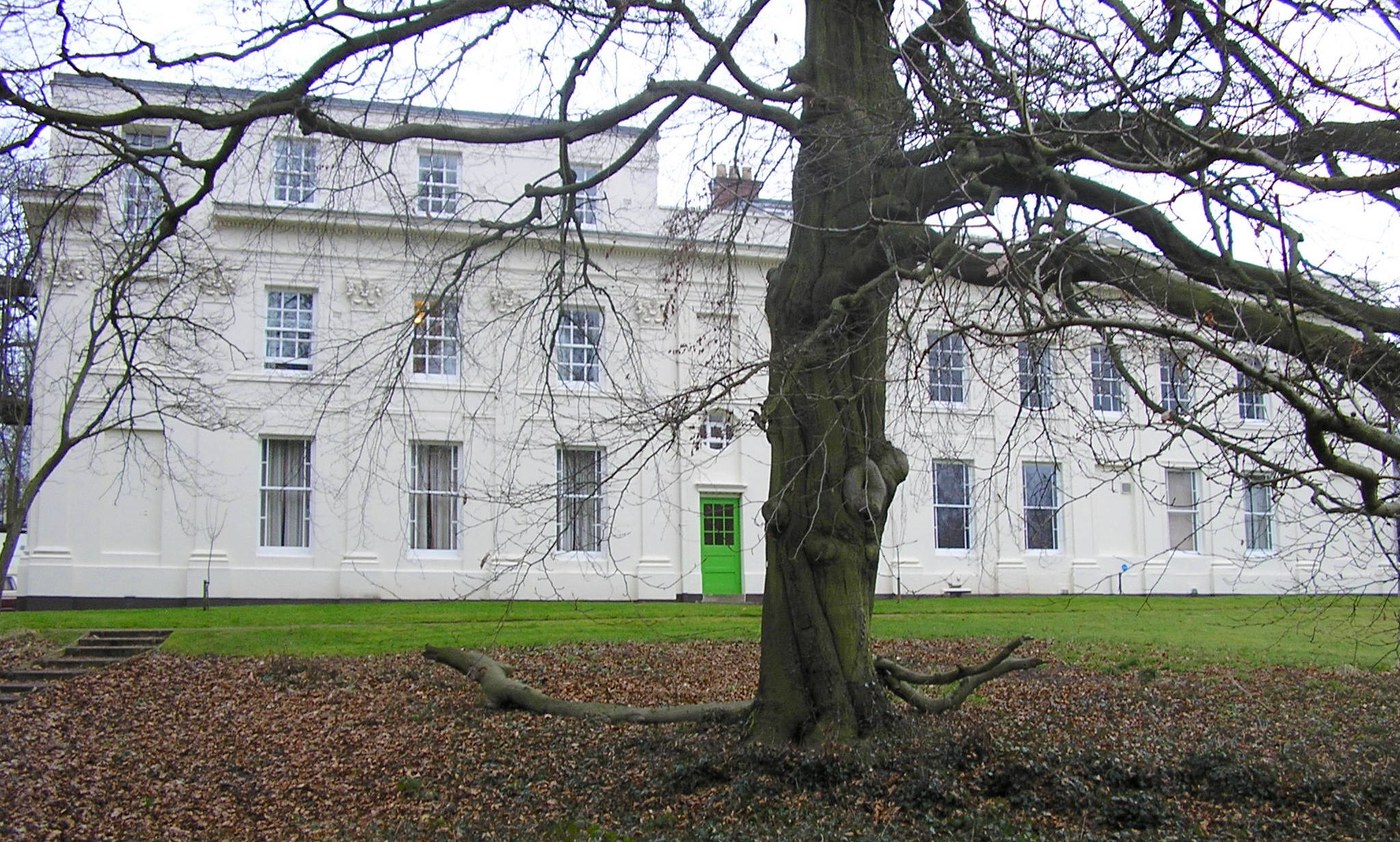 Front of the main house with green door