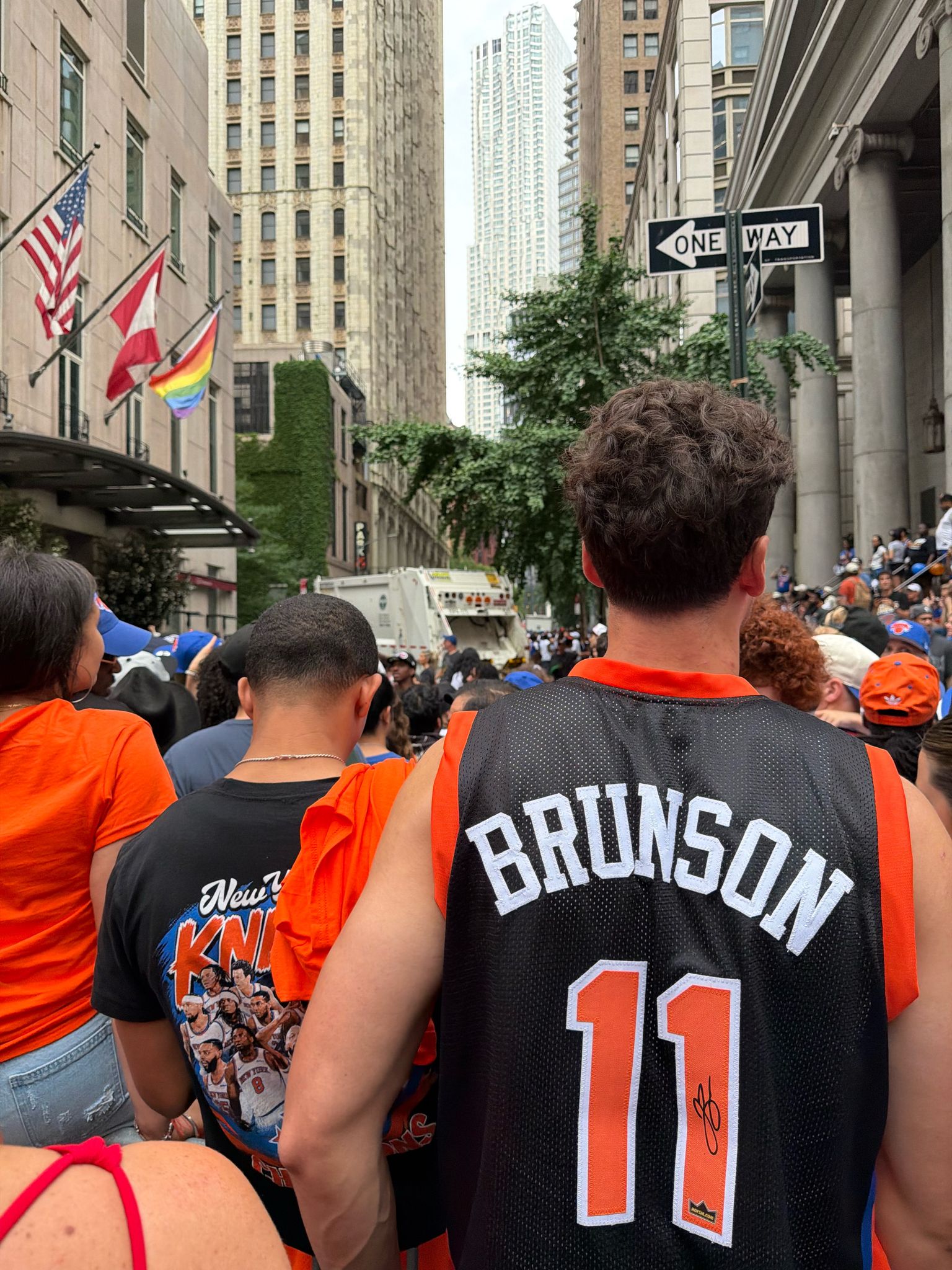 A fan in a BRUNSON 11 jersey in the Knicks parade crowd, Lower Manhattan, June 18, 2026