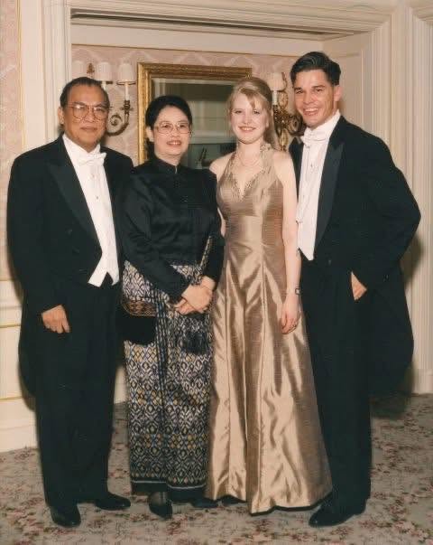 A vintage formal portrait of two couples at a party.