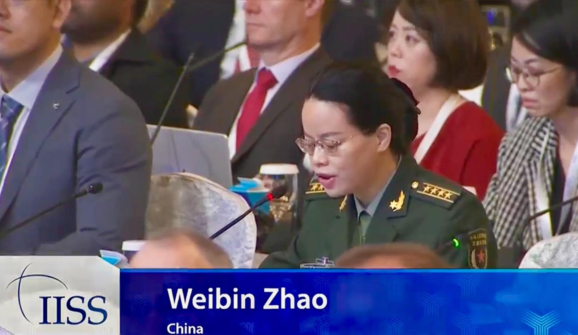 A video still of Weibin Zhao of China, in military uniform, speaking into a microphone at the IISS Shangri-La Dialogue in Singapore.