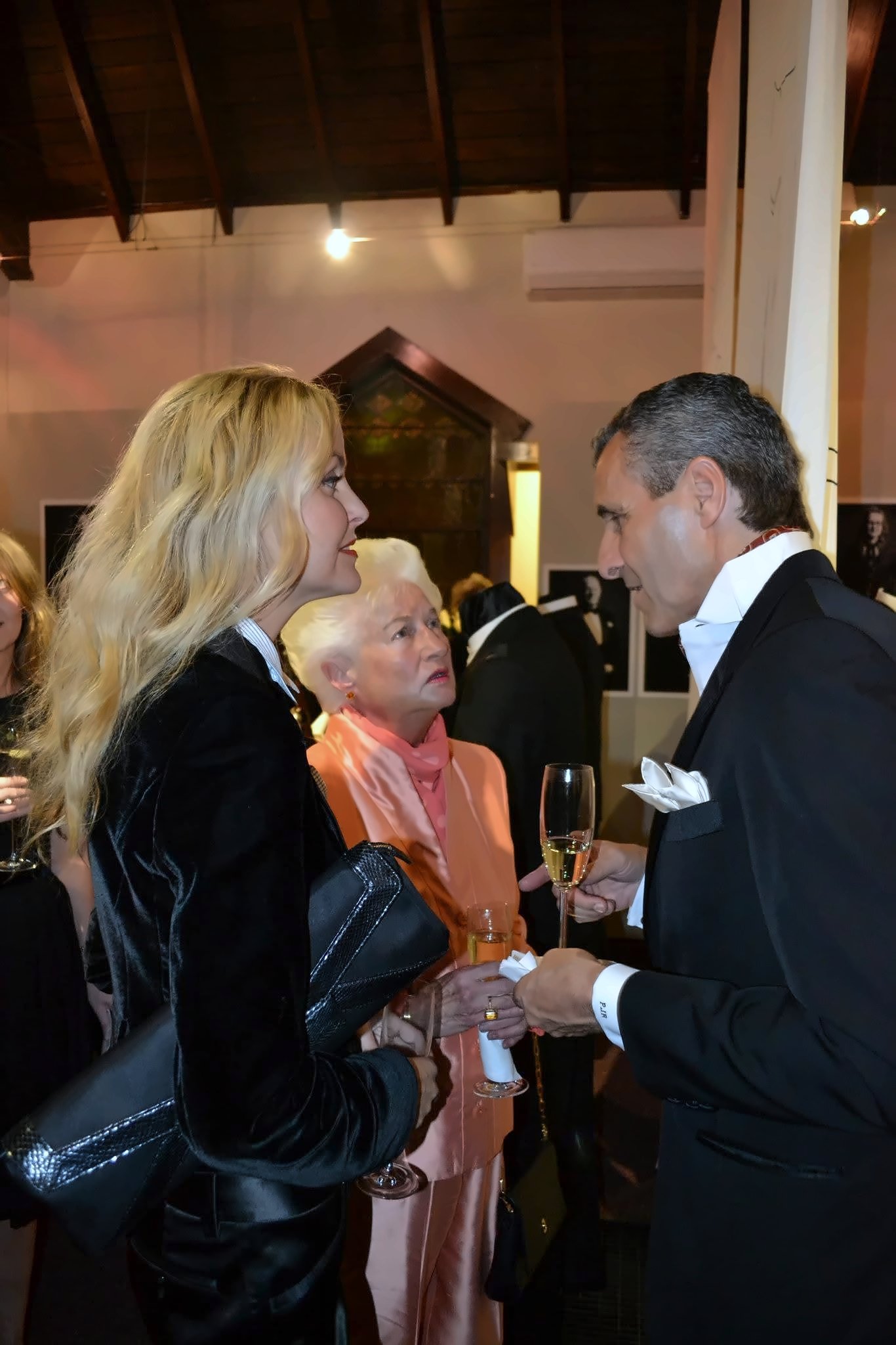 Velvet and silk: a black velvet jacket, and across from it a dinner jacket with a crisp white pocket square.