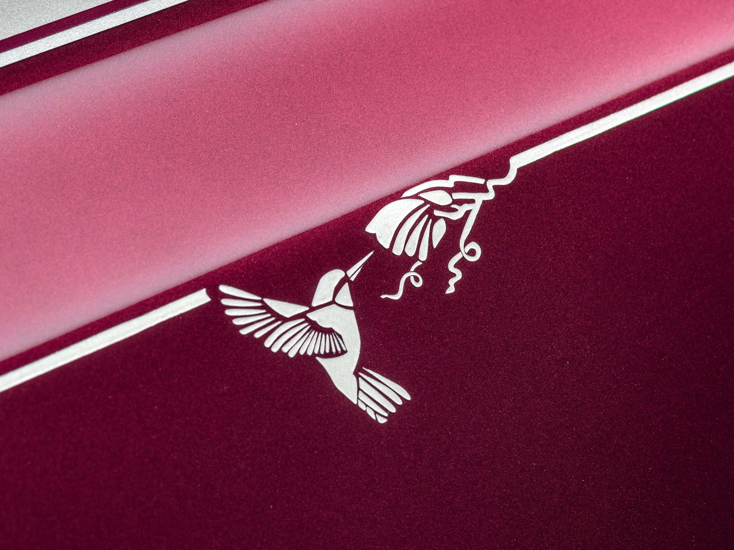 Hand-painted White Sands hummingbird motif on the coachline of Phantom Hummingbird, Wildberry and White Sands paint